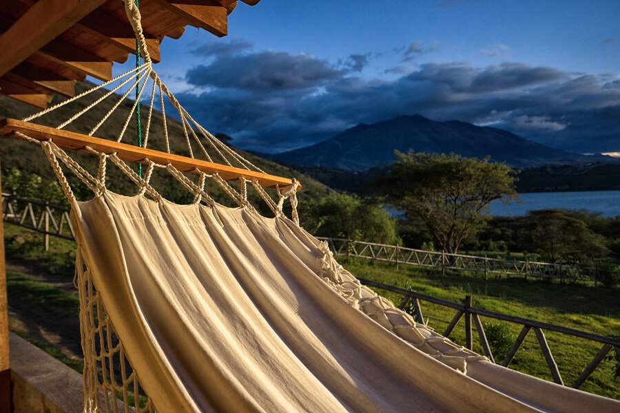 Hospedajes en antigua guatemala- Relaxing hammock with panoramic mountain views and a peaceful natural setting.