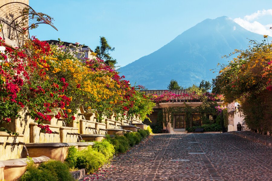 Colorful street in Antigua Guatemala with volcano view