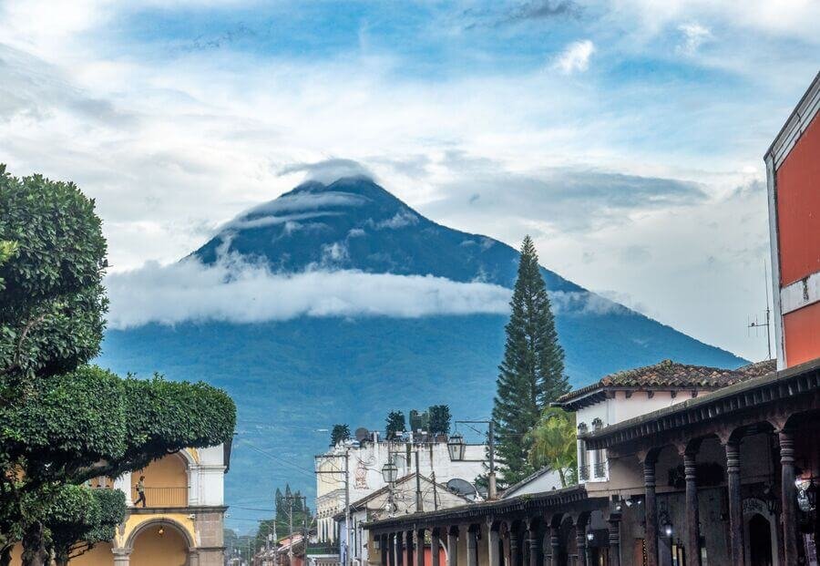 Antigua guatemala what to see - Scenic view of Antigua Guatemala with volcano, colonial architecture, and church steeple.