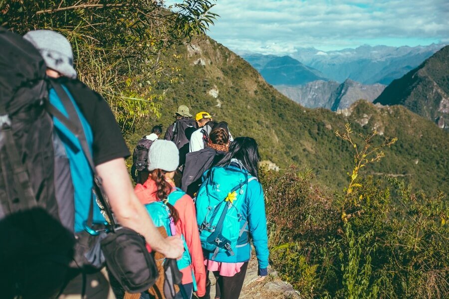 Things to do in antigua guatemal - Hikers exploring scenic mountain trails with breathtaking views in Guatemala.